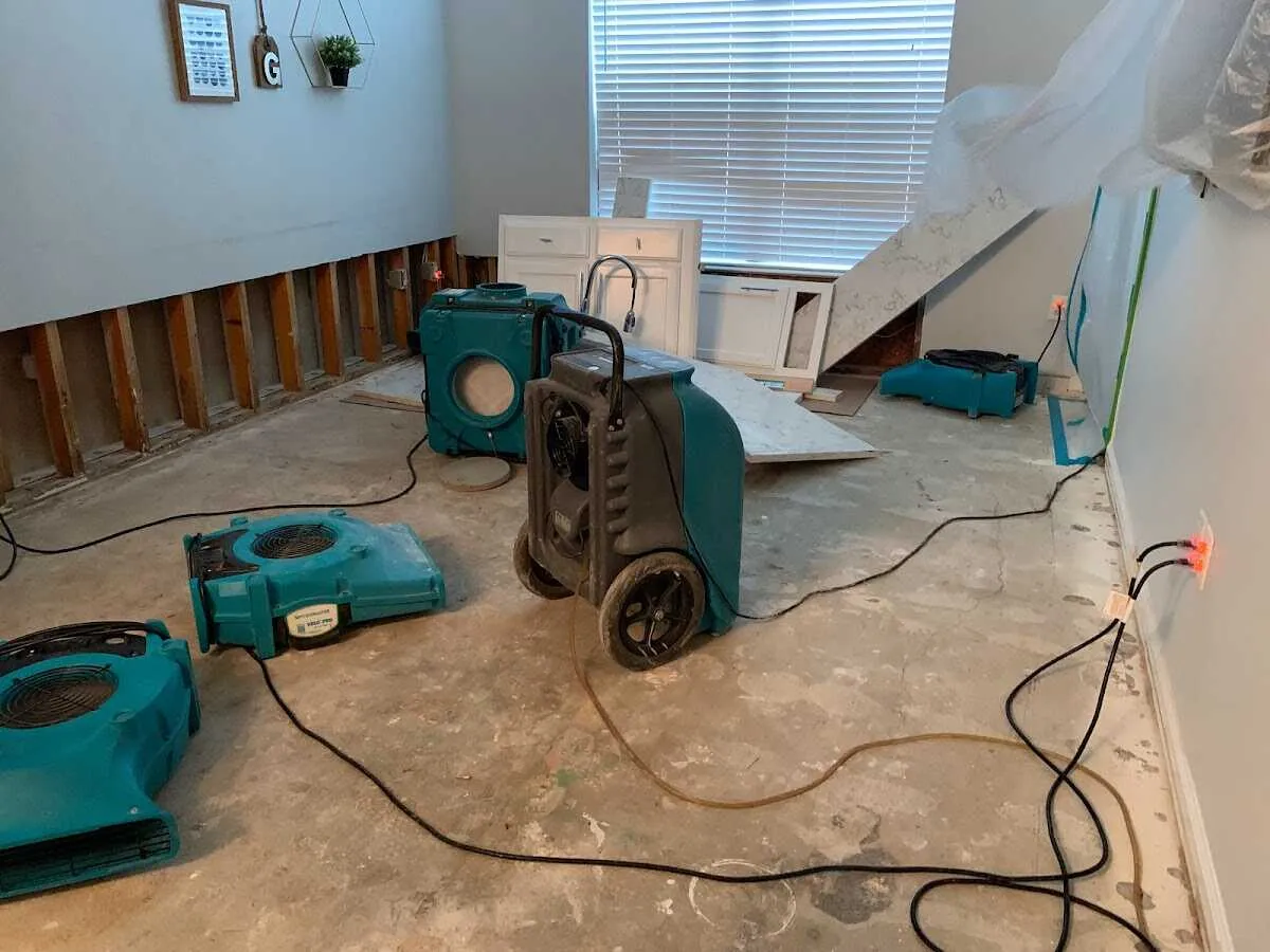 Dehumidifier in flood-cut room for Water Damage Restoration in Crouch Mesa